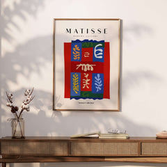 Matisse Art Prints - Patchwork Shapes Composition Poster displayed on a wall, showcasing vibrant abstract designs and colors.