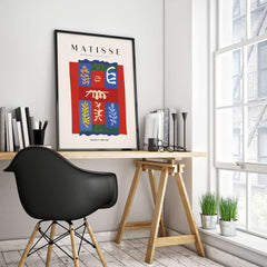 Matisse Art Prints - Patchwork Shapes Composition Poster framed in a home office with modern decor and plants.