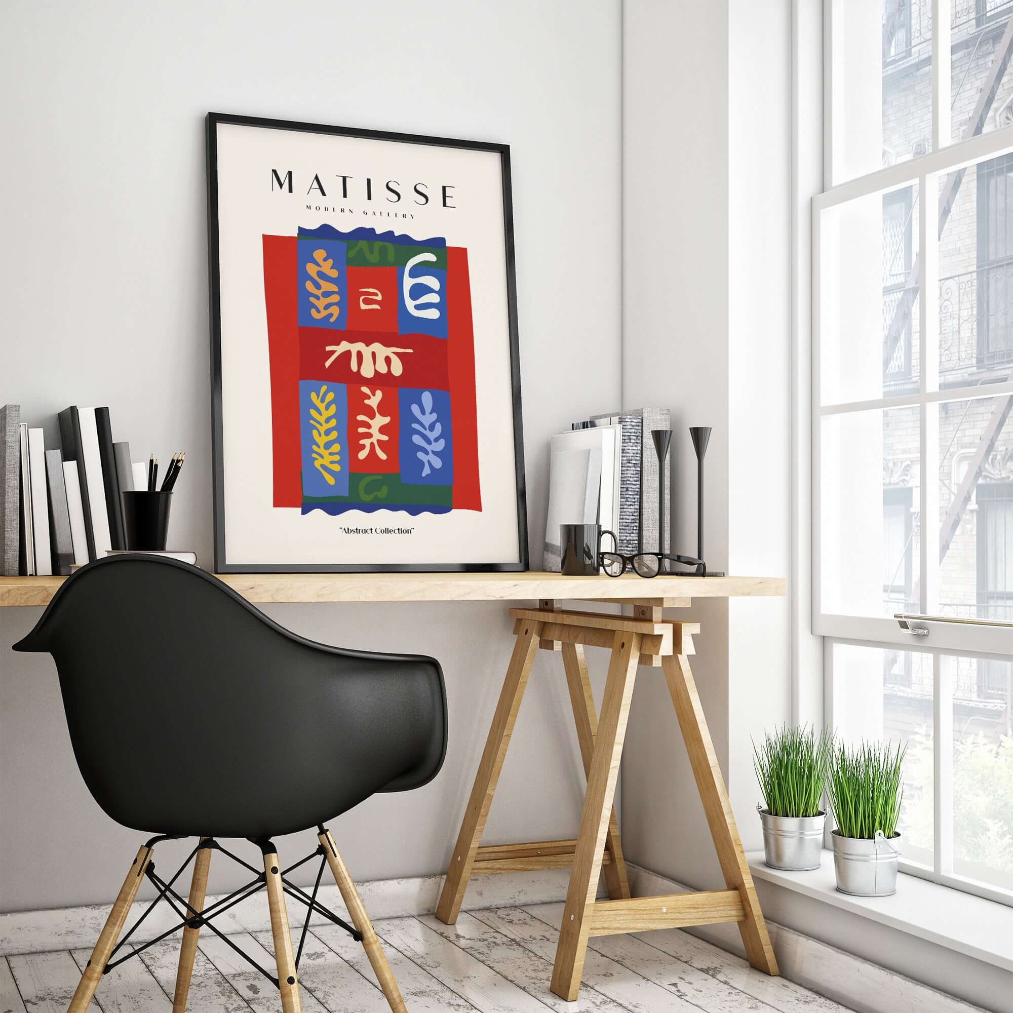 Matisse Art Prints - Patchwork Shapes Composition Poster framed in a home office with modern decor and plants.
