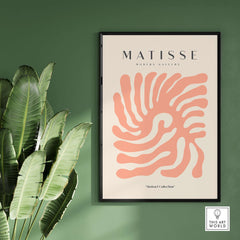 Matisse Art Prints - Peach Coral Swirl Abstract Poster displayed in a modern gallery setting with greenery.