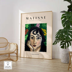 Matisse Art Prints - Pensive Woman Poster displayed in a modern gallery setting with abstract leaf shapes.