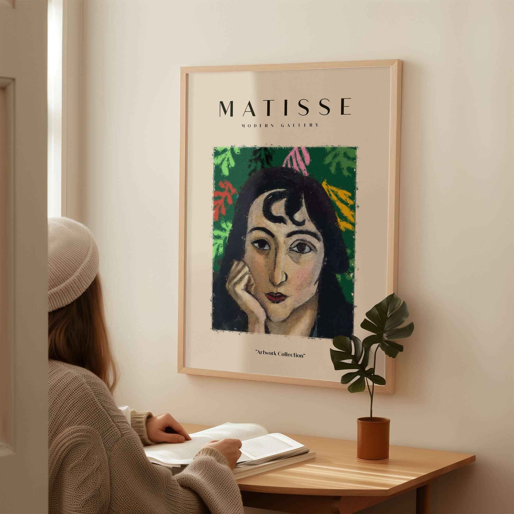 Matisse Art Prints - Pensive Woman Poster displayed on a wall, featuring a woman with dark curly hair against a green background.