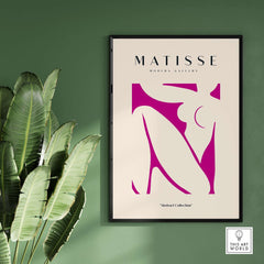Matisse Art Prints - Pink Abstract Nude Figure Art Print framed on a wall with green background and tropical plants.