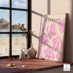Matisse Art Prints - Pink Abstract Shapes Pattern Poster displayed on a windowsill with beach view, modern decor.