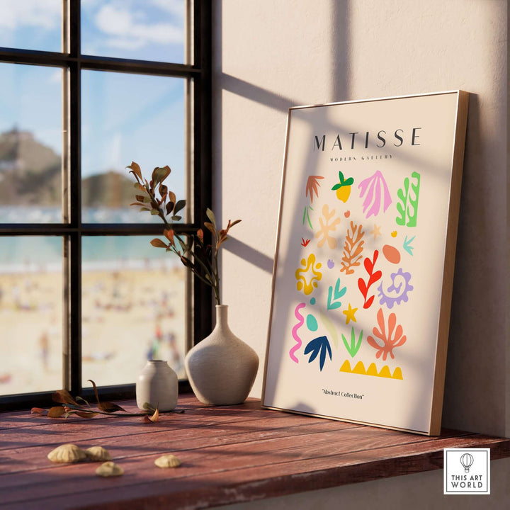 Matisse art print featuring playful abstract shapes in vibrant colors, displayed near a window.