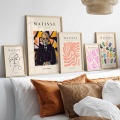 Matisse Art Prints - Portrait Man in Suit Geometric Wall Art displayed on a stylish shelf with decorative pillows.