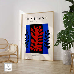 Matisse Art Prints -  Red Coral Black Leaves Blue Frame Poster displayed in modern decor setting.