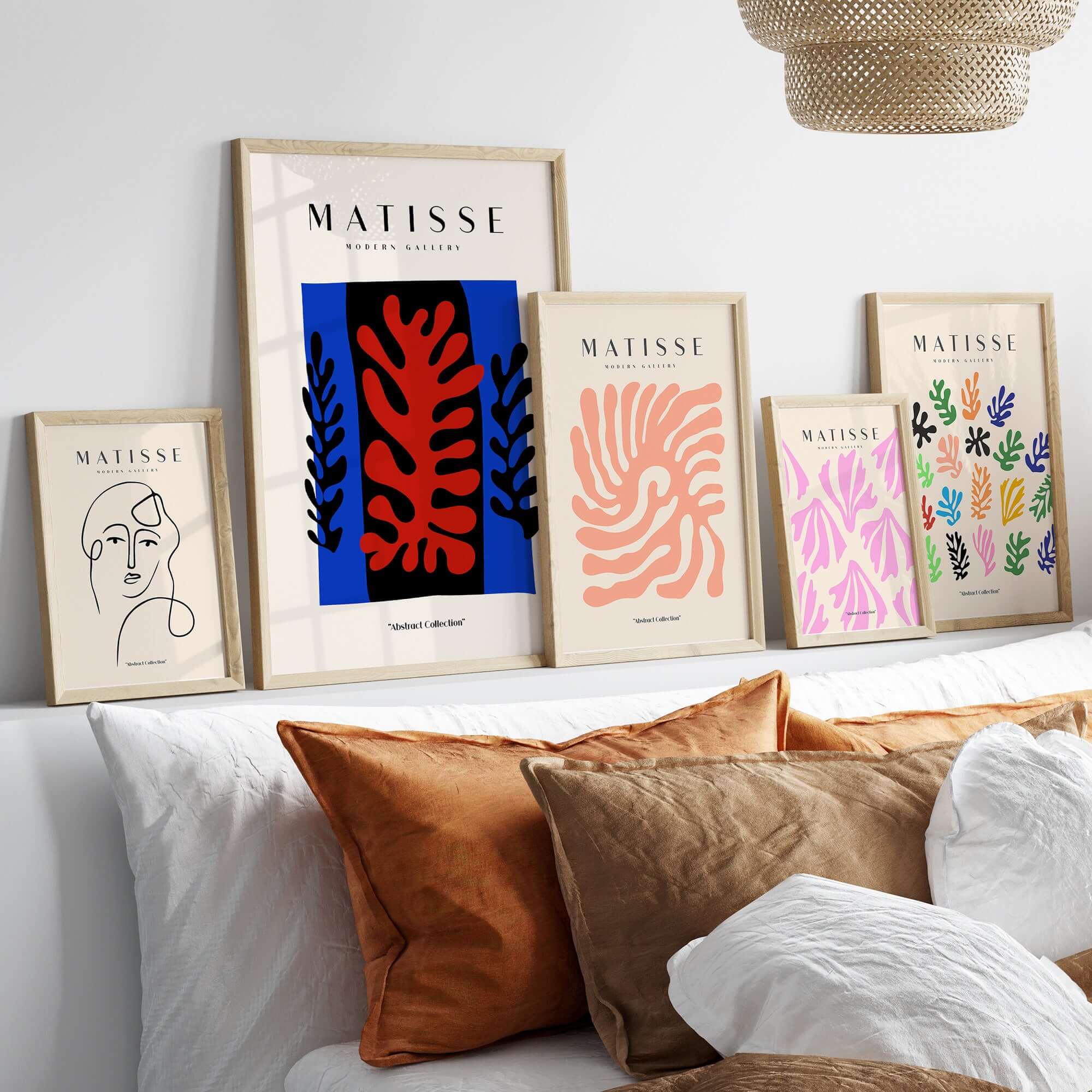 Matisse Art Prints -  Red Coral Black Leaves Blue Frame Poster displayed on a stylish wall with decorative pillows.