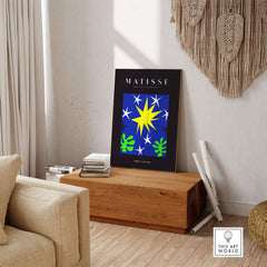 Matisse Art Prints - Stars Leaves Night Sky Abstract Print displayed in a stylish interior with a wooden table and decorative elements.