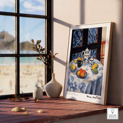 Matisse Art Prints - Still Life Blue Tablecloth Poster on a wooden table by a window with beach view.