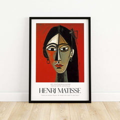Matisse Art Prints - Stylized Woman Portrait Red Wall Art displayed in a modern frame against a wooden floor.