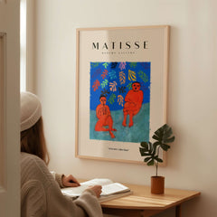 Matisse Art Prints - Two Figures Flute Poster displayed in a cozy interior with a person studying.