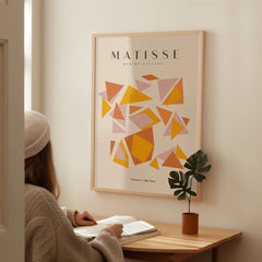 Matisse Art Prints - Warm Tone Geometric Triangles Poster displayed in a cozy room with warm colors and geometric shapes.