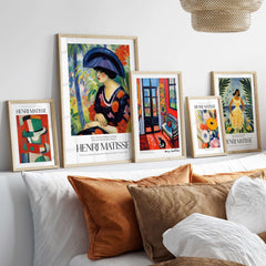 Matisse Art Prints - Woman with Blue Hat Garden Poster displayed on a stylish wall shelf with other art pieces.