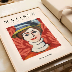 Matisse Art Prints - Woman in Elaborate Hat Portrait Poster on display with bold colors and modern design.