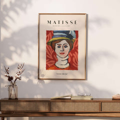 Matisse Art Prints - Woman in Elaborate Hat Portrait Poster showcased on a wall with natural light.