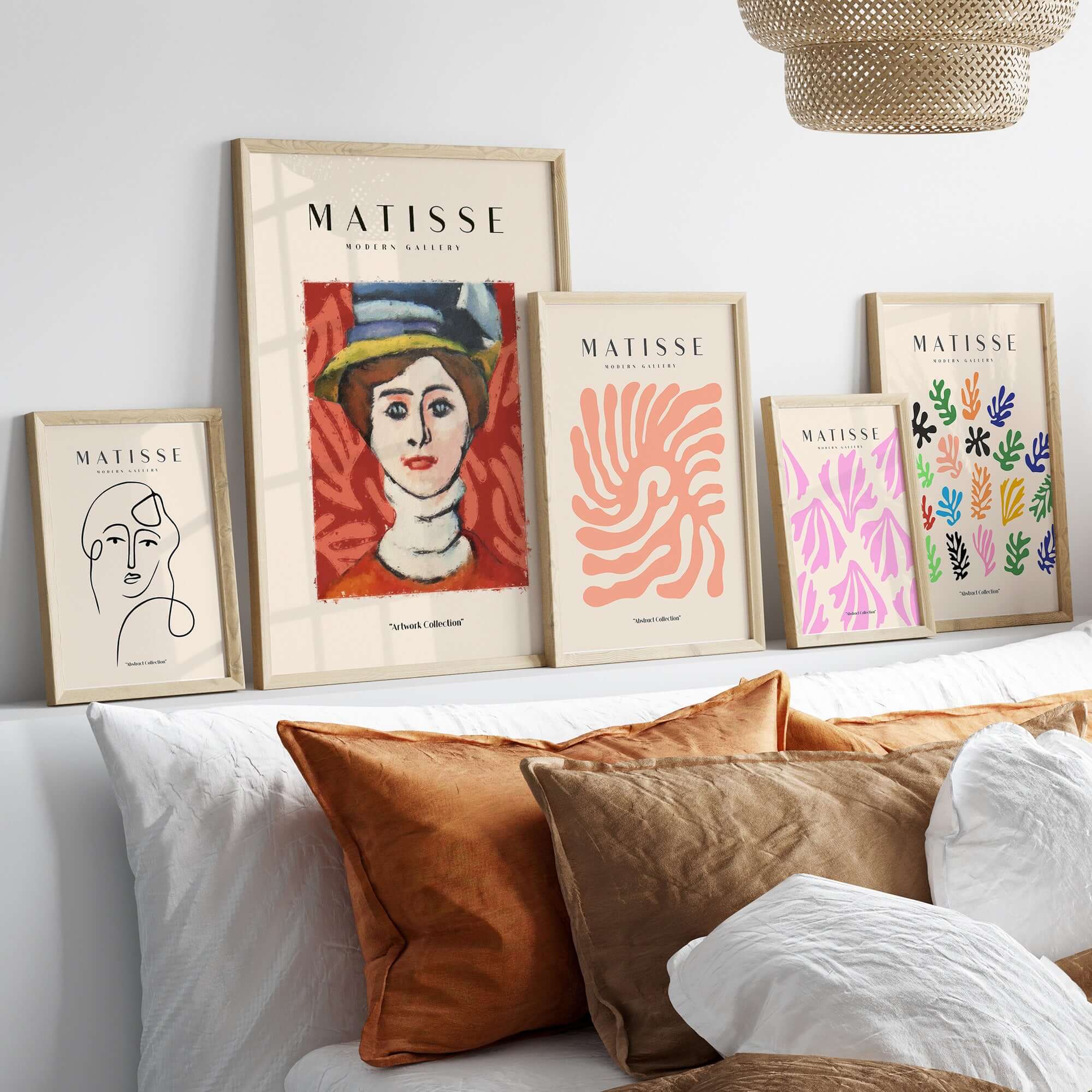 Matisse Art Prints - Woman in Elaborate Hat Portrait Poster displayed on a modern wall above stylish cushions.