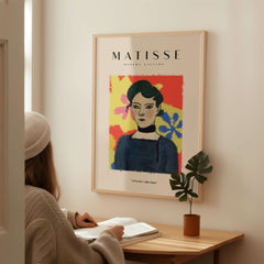 Matisse Art Prints - Woman Portrait Abstract Floral Poster displayed on a wall, featuring a woman with dark hair and colorful background.