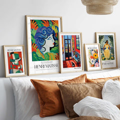 Matisse Art Prints - Woman with Flowers Abstract Art Print displayed in stylish frames on a shelf above a sofa.