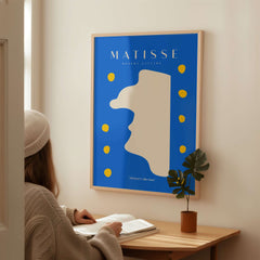 Matisse Art Prints -  Blue Abstract Profile with Yellow Dots Poster displayed in a minimalist interior setting.