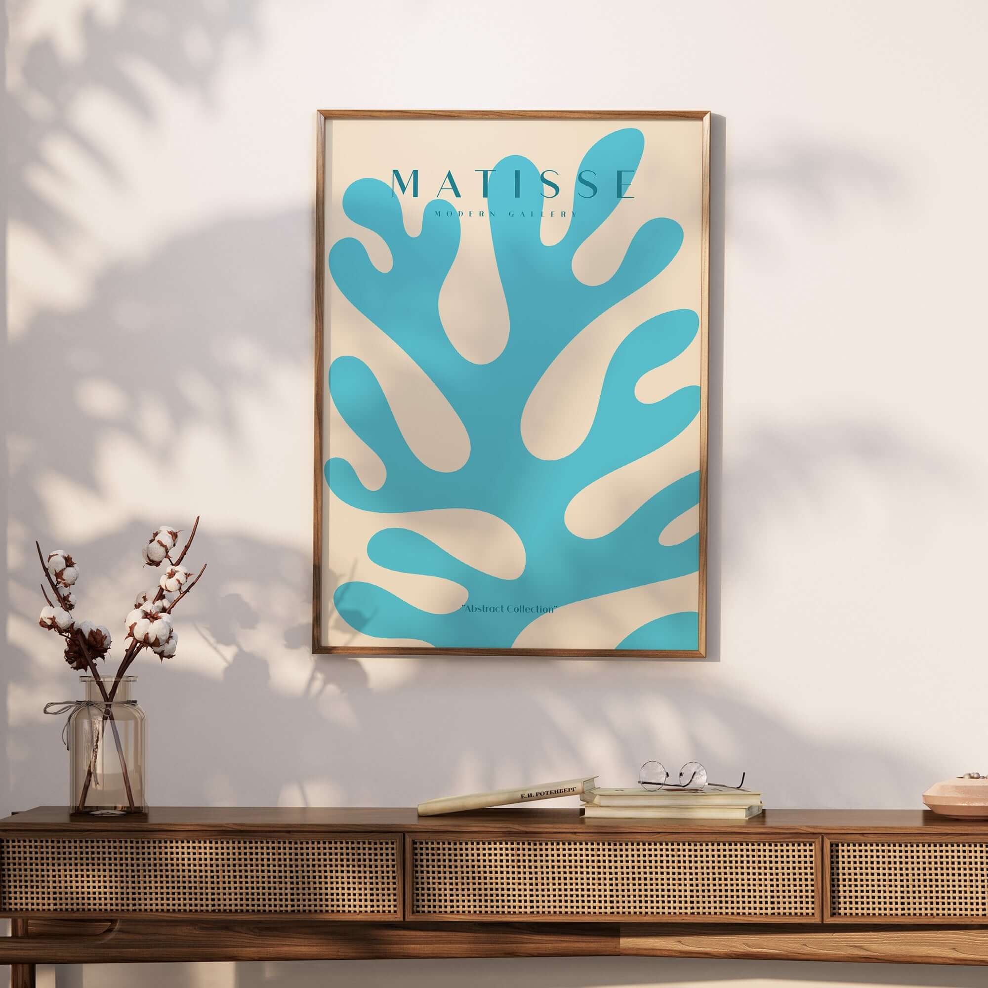 Matisse Art Prints -  Blue Coral Abstract Botanical Art Print Poster displayed on a wooden table with plants.