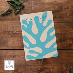 Matisse Art Prints -  Blue Coral Abstract Botanical Art Print Poster displayed against wooden background.
