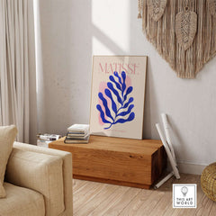 Matisse Blue Leaf Abstract Papiers Découpés Wall Art Print displayed in a cozy living room setting.