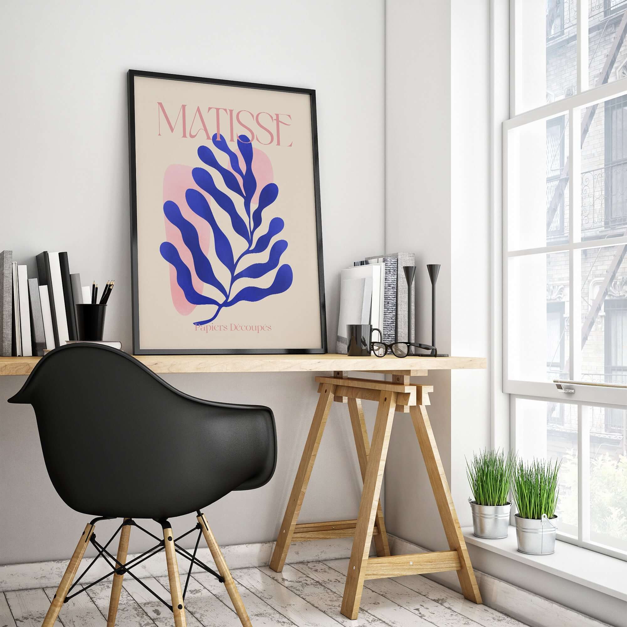 Matisse Blue Leaf Abstract Papiers Découpés Wall Art Print displayed in a modern workspace with a black chair.