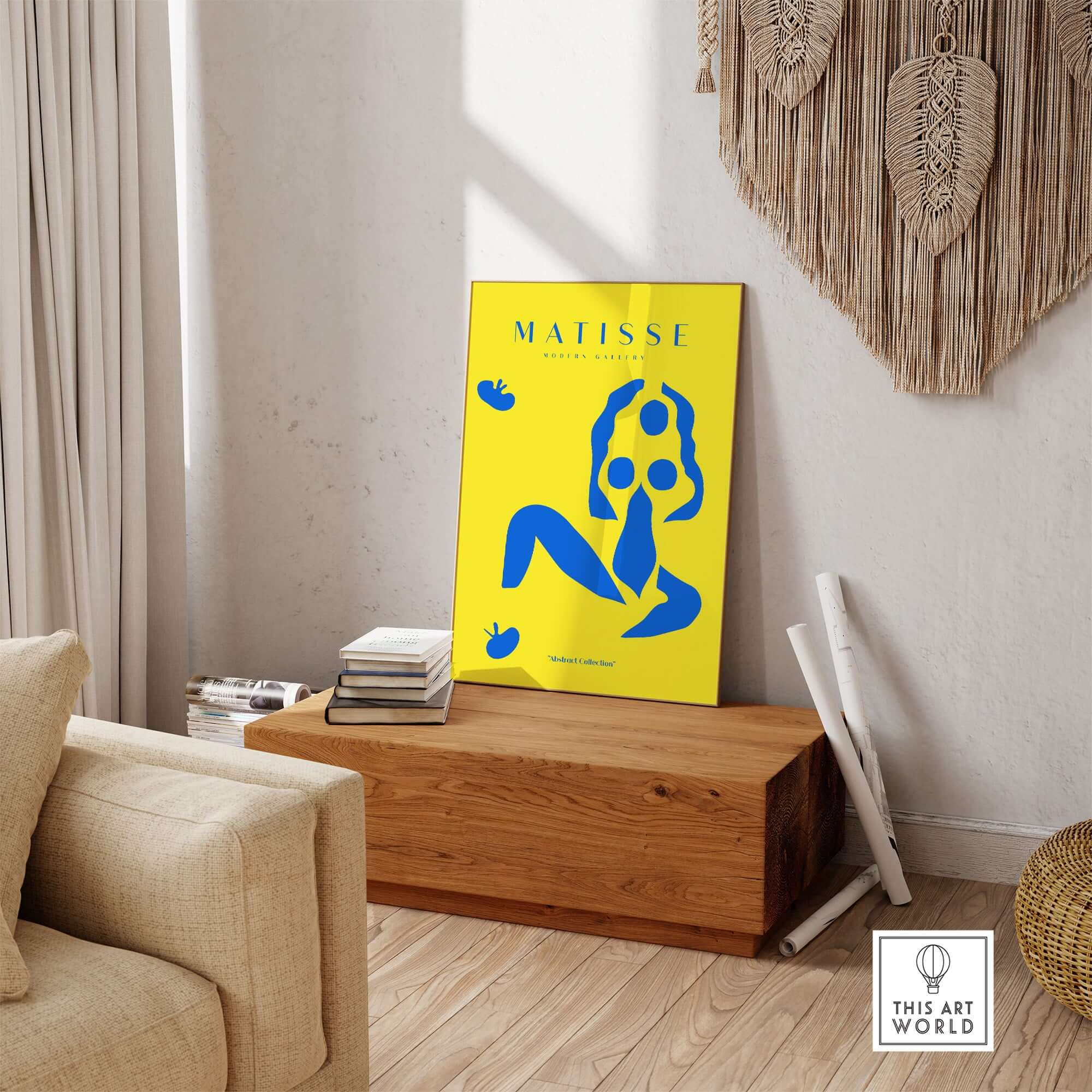 Matisse Art Prints - Blue Nude Abstract Figure Yellow Poster displayed on a wooden table in a stylish living room.