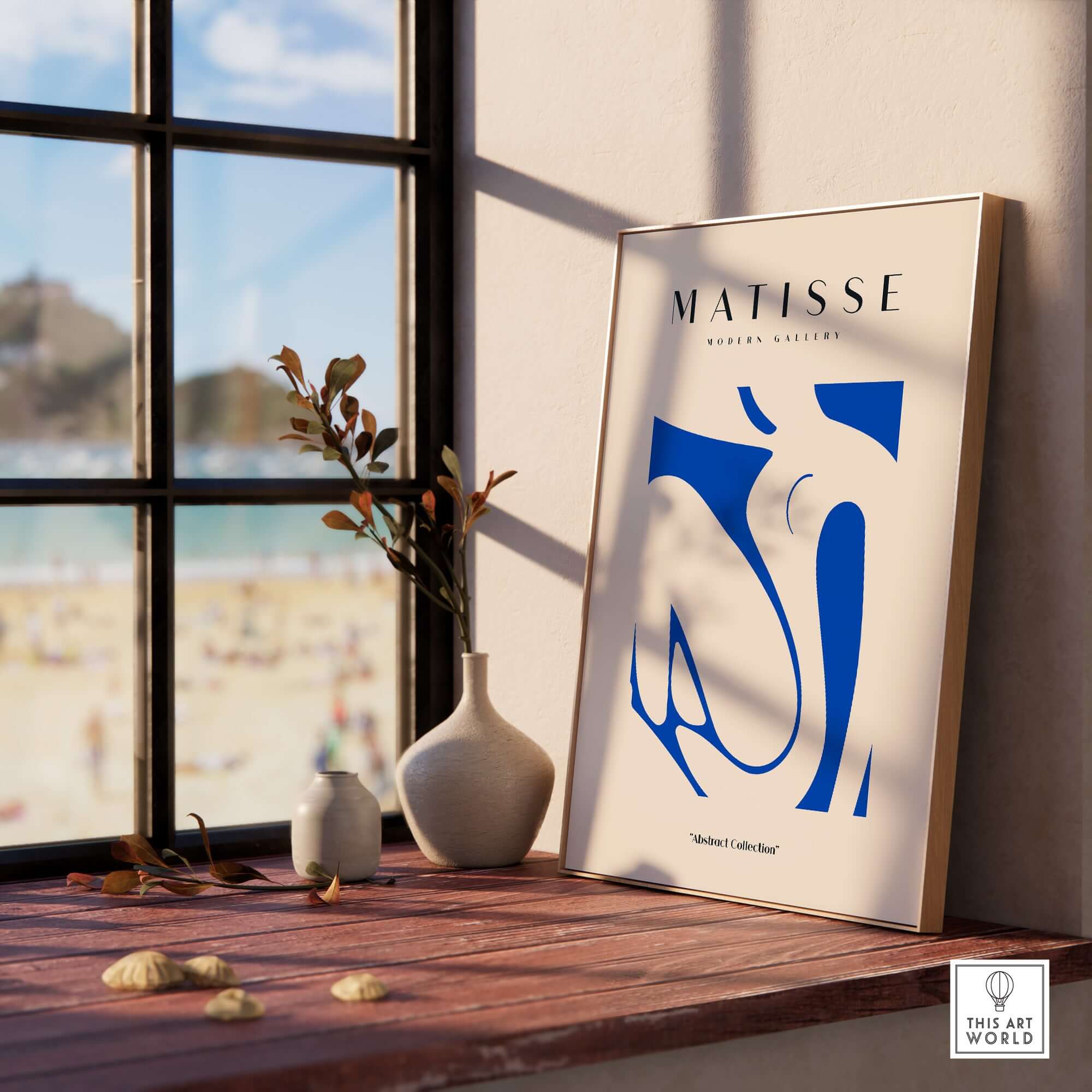 Matisse Art Prints - Blue Nude Abstract Cut Out Wall Art displayed in a bright room with beach view, framed and accentuated.