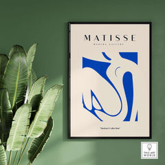Matisse Art Prints - Blue Nude Abstract Cut Out Wall Art displayed in a modern setting with greenery.