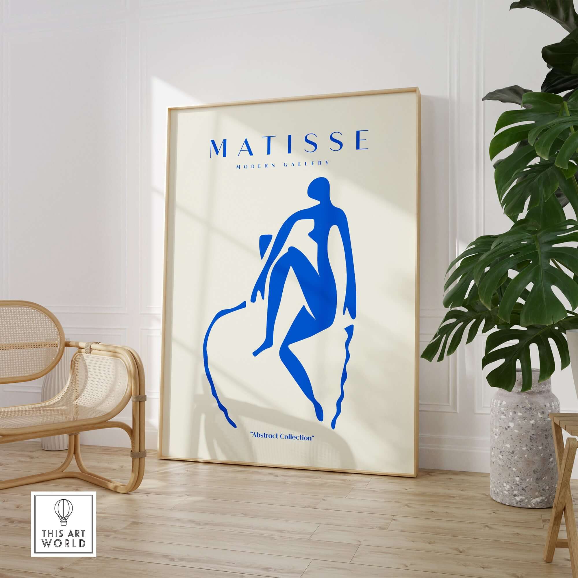 Matisse Art Prints -  Blue Nude Seated Figure Poster displayed in a stylish interior with a chair and plant.