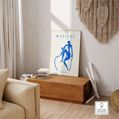 Matisse Art Prints -  Blue Nude Seated Figure Poster featuring a bold blue silhouette in a stylish home setting.