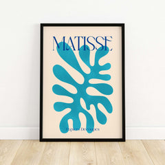 Matisse Cyan Blue Abstract Shape Papiers Découpés Poster displayed in a stylish frame against a neutral wall.