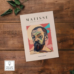Matisse Art Prints - Expressive Self Portrait Poster displayed on a wooden surface, featuring a colorful self-portrait.