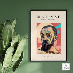 Matisse Art Prints - Expressive Self Portrait Poster framed art print on green wall with plants.