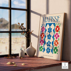 Matisse Large Decoration with Masks Vertical Panel Art Print displayed on a table with decorative vase and beach view.