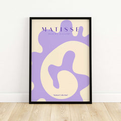 Matisse Art Prints -   Lavender Abstract Fluid Organic Shape Poster displayed in a modern frame on a wooden floor.