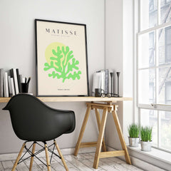 Matisse Art Prints - Lime Green Coral Abstract Sun Print displayed in a stylish workspace with modern decor.