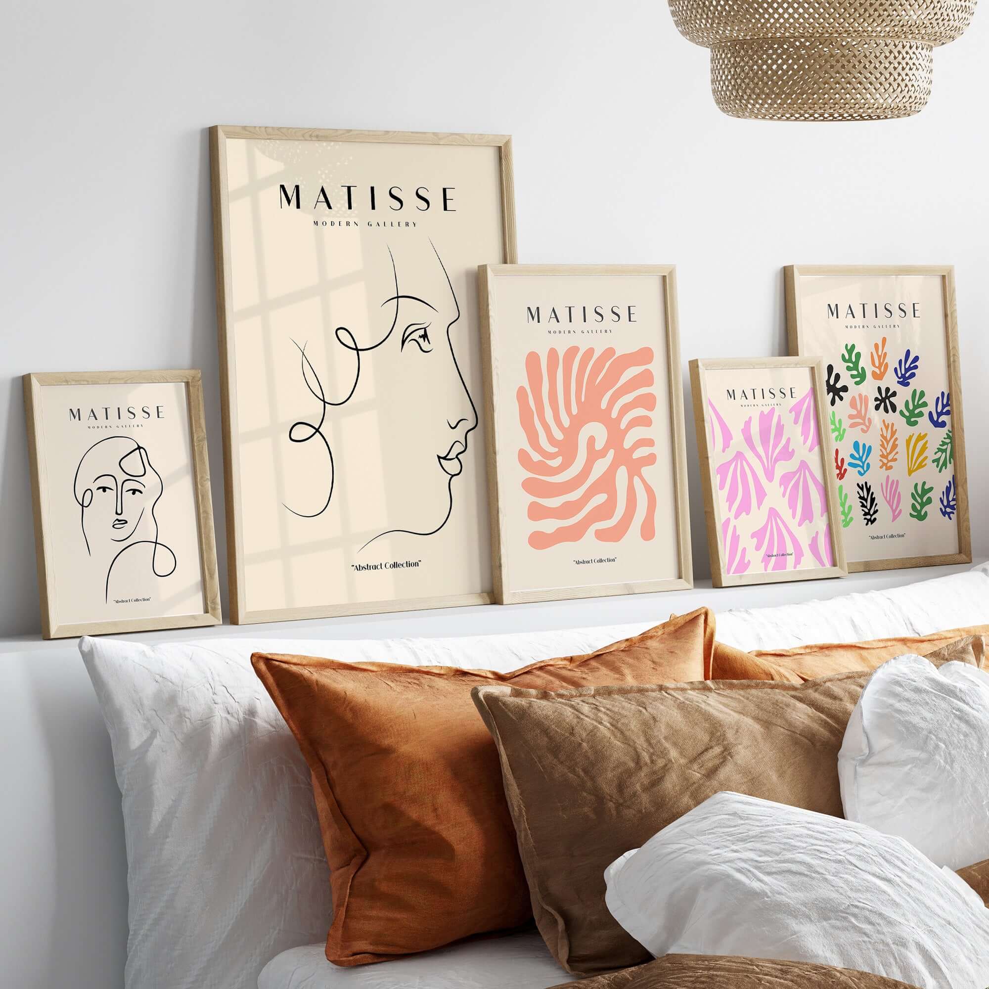 Matisse Art Prints -  Line Art of a Lady's Face Poster displayed with other art prints on a modern interior wall.