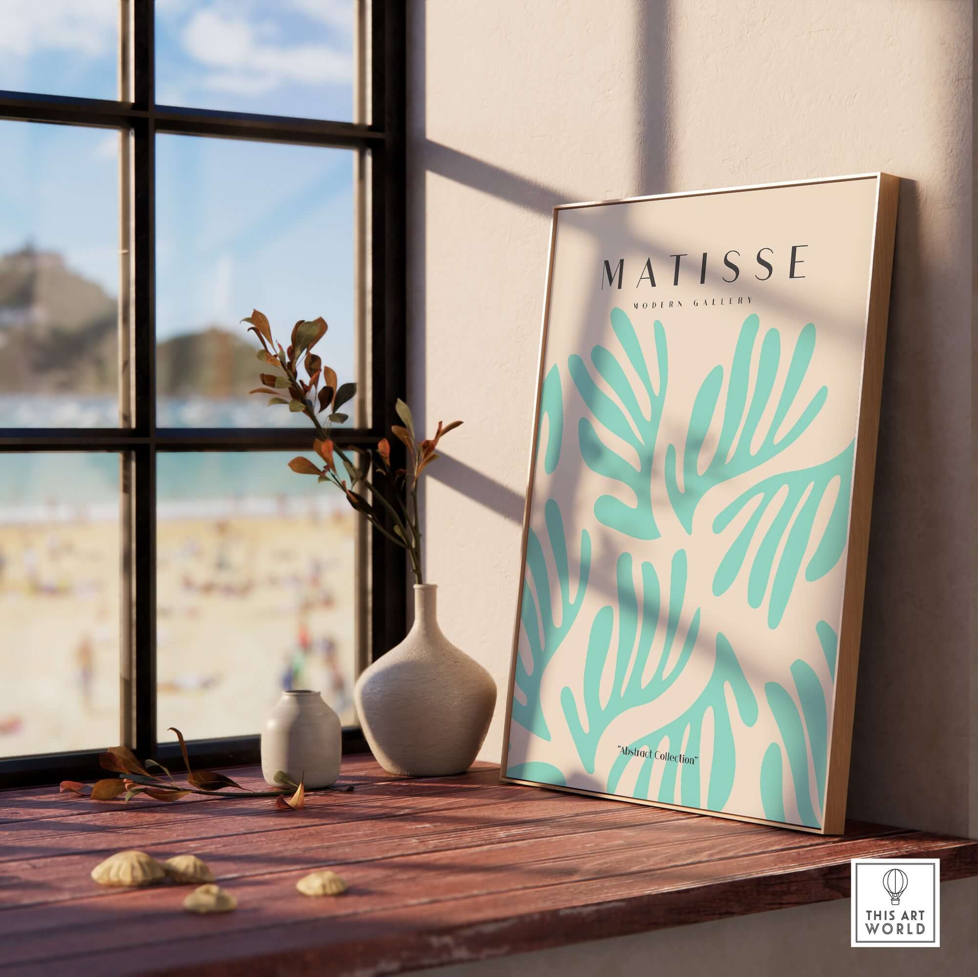 Matisse Art Prints - Mint Green Fan Pattern Poster Art displayed on a wooden table by a window, featuring light teal leaf patterns.