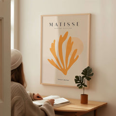 Matisse Art Prints - Orange Seaweed Abstract Art Print displayed on a wall, featuring vibrant orange seaweed design.