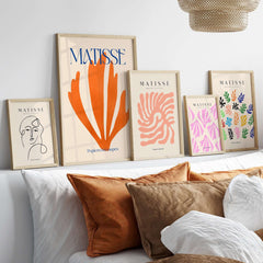 Matisse Papiers Découpés Orange Abstract Botanical Cut Out Art Print displayed on a modern wall with decorative pillows.