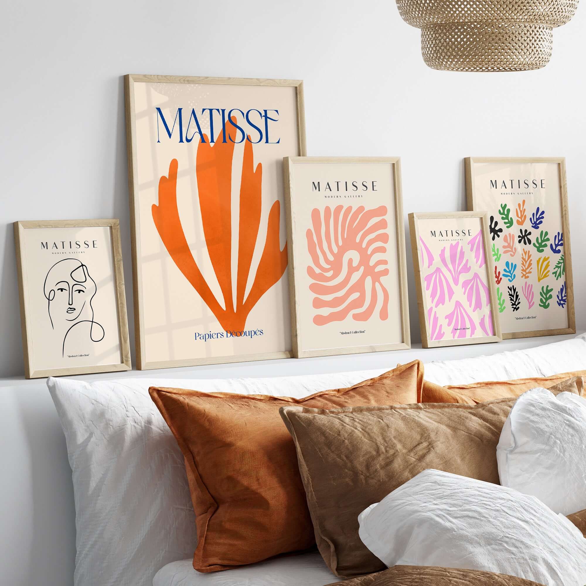 Matisse Papiers Découpés Orange Abstract Botanical Cut Out Art Print displayed on a modern wall with decorative pillows.