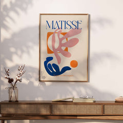 Matisse Papiers Découpés Pink Blue Abstract Art Print displayed on a wall, showcasing vibrant colors and dynamic shapes.