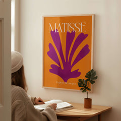 Matisse Papiers Découpés Purple Cut Out on Orange Background Abstract Art Print displayed in a modern interior setting.
