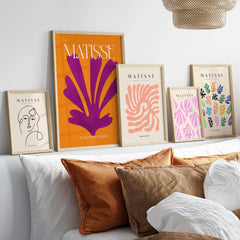 Matisse Papiers Découpés Purple Cut Out on Orange Background Abstract Art Print displayed elegantly in a modern living room.