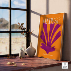 Matisse Papiers Découpés Purple Cut Out on Orange Background Abstract Art Print displayed in a modern interior setting.