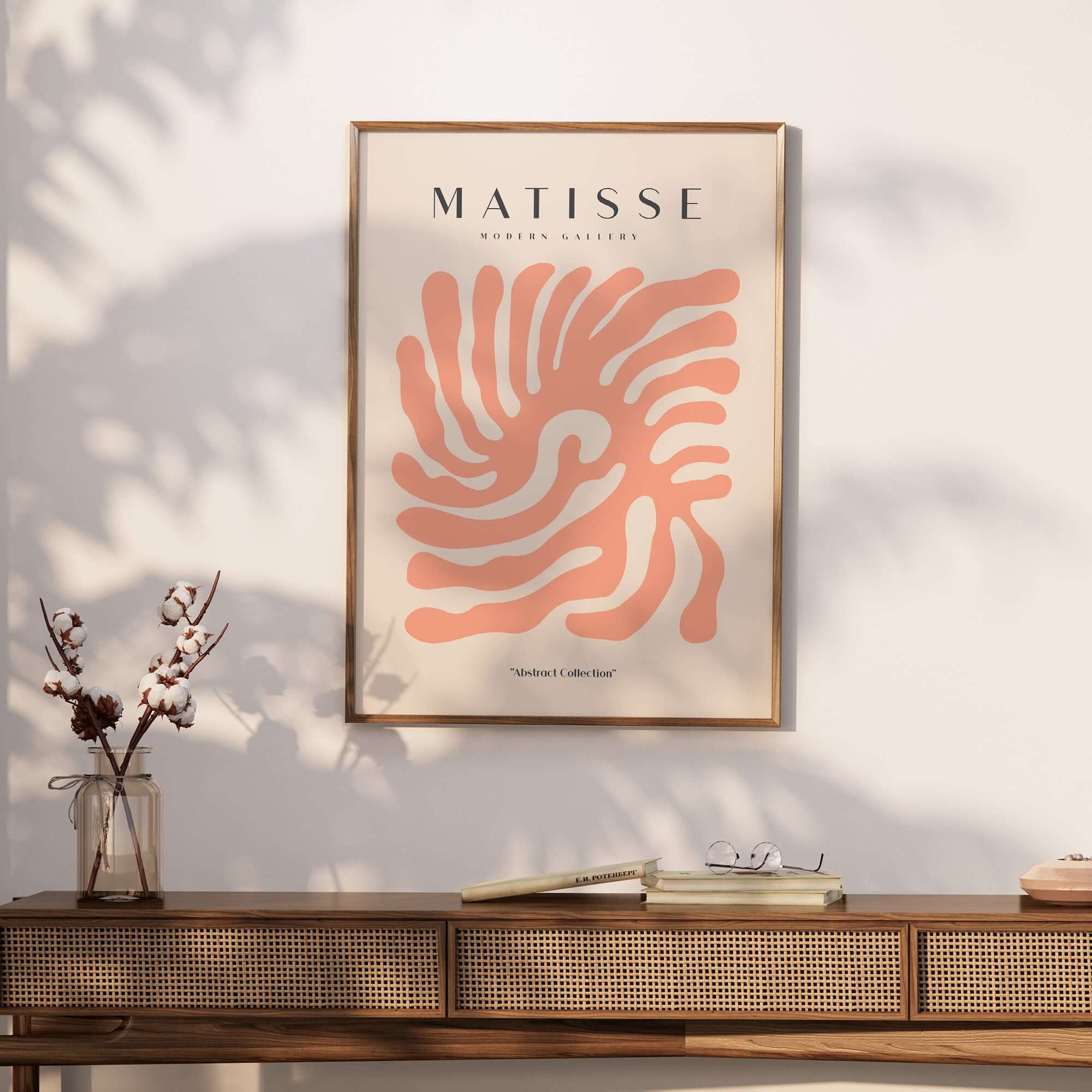 Matisse Art Prints - Peach Coral Swirl Abstract Poster displayed on a wall with a wooden console and decorative items.