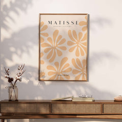 Matisse Art Prints - Peach Floral Abstract Pattern Print displayed in a stylish frame against a wooden console.